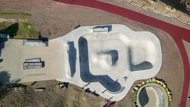An aerial top-view perspective captures Skatepark Parque das Gera&ccedil;&otilde;es, situated at Estoril, Portugal, symbolizing leisure, fitness, and recreational activities for free time enjoyment.