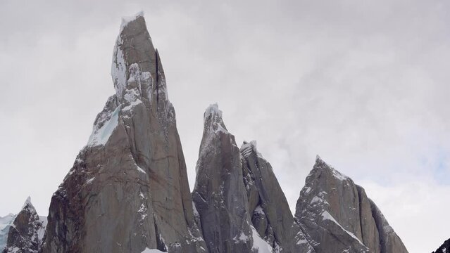 Close view of Cerro Torre, Torre Egger and Cerro Standhardt  with fast moving clouds . Extreme weather conditions. Patagonia, Argentina