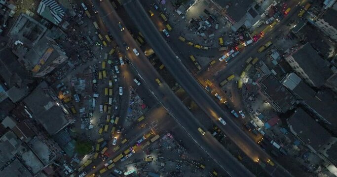 Captivating aerial view: Lagos by night, pulsating with life. Glowing cityscape, bustling traffic on bridge&mdash;a vibrant metropolis in motion