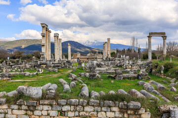 The extensive ruins of Afrodisias lay scattered before a stunning mountain backdrop, where the...