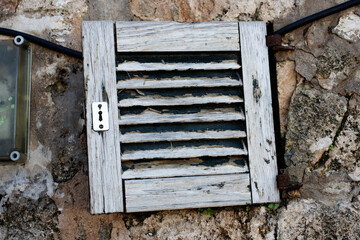 detail close up of hinge and bolt of typical Menorca windows and doors