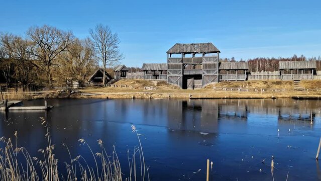 Old Wooden Defensive Gate And Walls By The Lake At Cinevilla Studio In Tukums, Latvia. wide shot