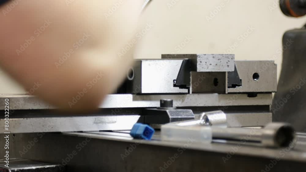 Aufkleber close-up of a worker operating a milling machine in a factory