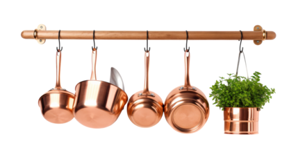 A collection of pots and pans hanging on a decorative rack in a kitchen