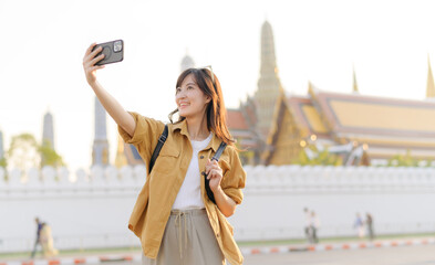 Traveler asian woman in her 30s explores the Grand Palace with a local guide. Uncover hidden gems and immerse yourself in Thai culture with her adventure.
