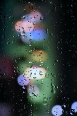 rain drops on window. Rain drops and lights. wet glass window. rain background. rain season.  rain drops pattern. relax