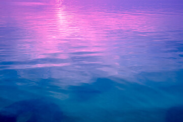 Sea water surface. View from above. Artistic pink-blue gradient color