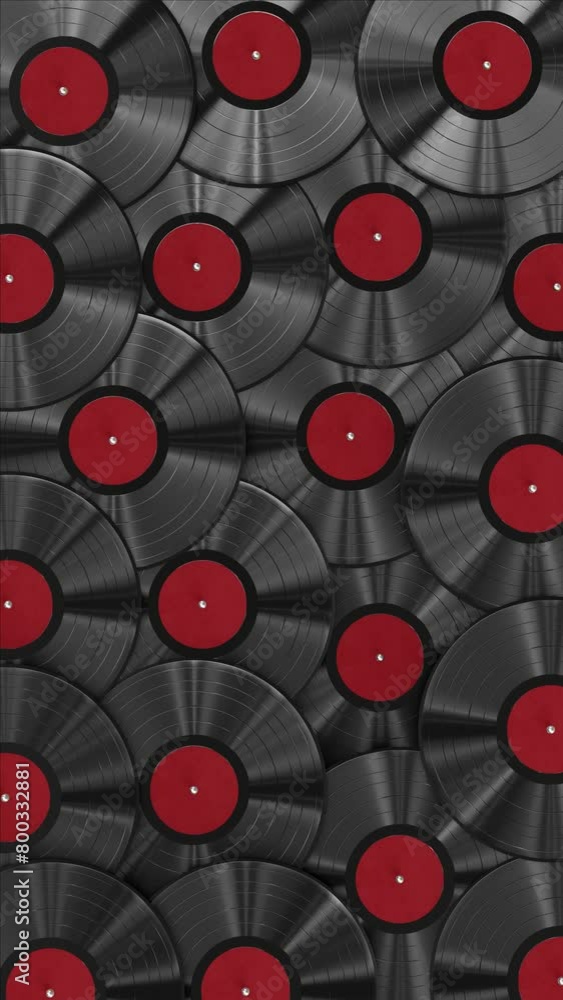 Poster vertical video. realistic looping 3d animation of the classic black vinyl records with red labels re
