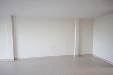 White room for the background. empty room interior, white mortar wall and clean tile floor in a new...