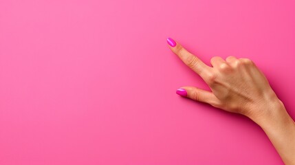   A woman's hand, sporting a pink manicure, gestures towards the camera against a matching pink background