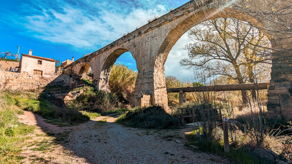 Riverside Ramble: Trek through Stunning Landscapes near Calanda, Teruel, Bathed in Sunshine, Amidst...