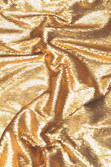 Golden sequins fabric texture.