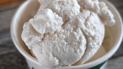 Vanilla ice cream in a paper cup