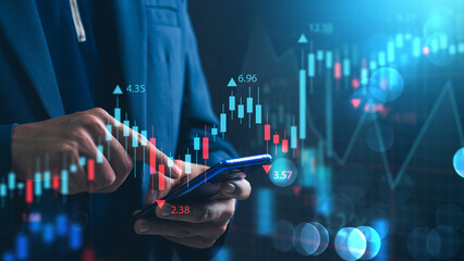 Investing and stock market concept. A businessman checks financial data charts for trading forex, stocks, money, and digital assets. business finance, technology, and investment.