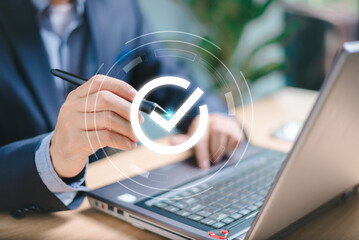 Business performance internet checklist. Businessman use computer laptop test online checklist...