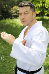 Sporty man with a kimono posing