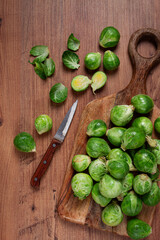 fresh Brussels sprouts, raw, top view, on a wooden table, no people,