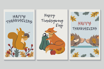 Happy Thanksgiving day set of posters in flat cartoon design. Three posters depict cute animals surrounded by leaves, pumpkins and apples, illustrating to us the beauty of autumn. Vector illustration.