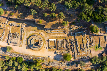 Delphi, Greece. Ruins of an ancient city. Tholos of Athena Pronaia, Temple of Athena, Treasury of the Massaliots. Summer morning. Aerial view