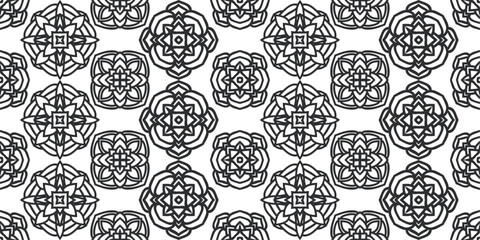 Ornate ornament and repeating pattern. Black kaleidoscopic shapes.