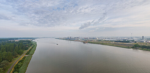 Antwerp, Belgium. Panorama of the city. River Scheldt (Escout). Summer morning. Industrial area. Aerial view