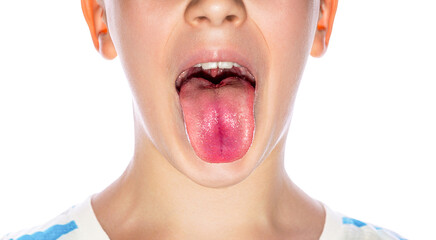 Little boy showing her tongue. Child puts out tongue - close up. Little boy sticks out his tounge....