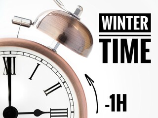 Alarm clock at 3 o'clock changing to Winter Time. Fall back or time change concept