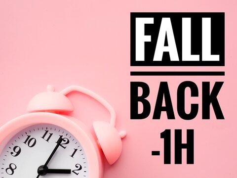 Alarm clock at 2 o'clock changing to Winter Time. Fall back or time change concept