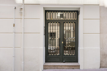 Metal entrance portal on the facade of a residential building