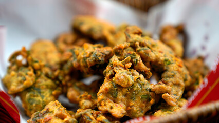 Potato Pakora, Palak Pakora with Green Chutney and Mint chutney on the table