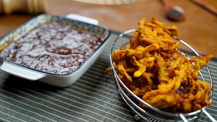 Potato Pakora, Palak Pakora with Tamarind Chutney and Potato Ketchup on the table