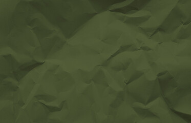 close up view of dark green crumpled piece of construction paper use as background with blank space...