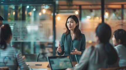 Asian Businesswoman on a team meeting in a modern office setting