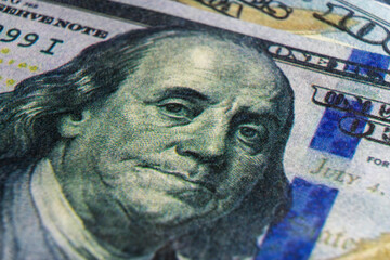 Benjamin Franklin's face on the US 100 dollar bill. Closeup of Ben Franklin on a one hundred dollar...