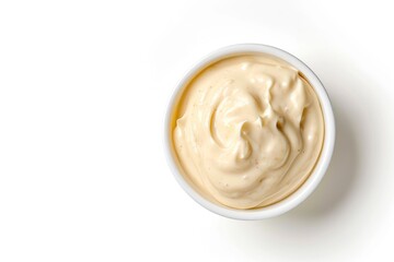 mayonnaise in mini white bowl on whte background top down view