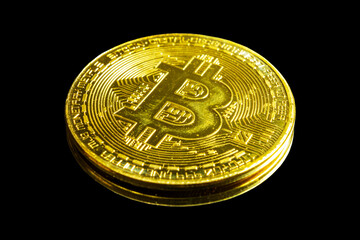 Golden bitcoin on black background. Bitcoin cryptocurrency