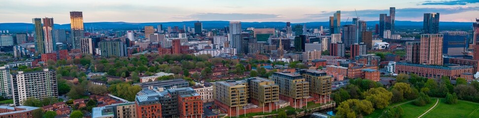 Wide Panoramic aerial image of Salford and Manchester Skyline taken above river Irwell