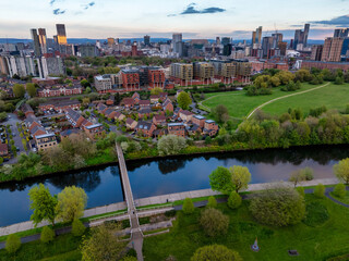 Aerial landscape view above river Irwell in Salford, showing the city of Manchester and Salford skyline