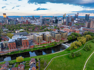 Aerial landscape view above river Irwell in Salford, showing the city of Manchester and Salford skyline