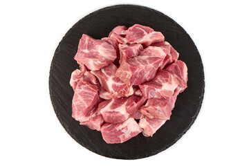 Raw pork pieces, isolated on white background. High resolution image