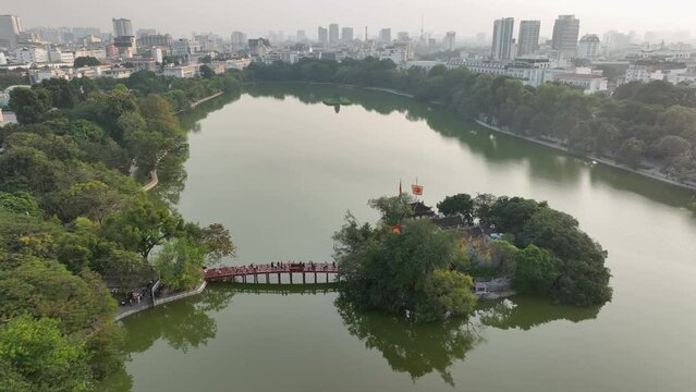 Hoan Kiem lake aerial drone view with Ngoc Son temple and The Huc bridge in Hanoi, Vietnam