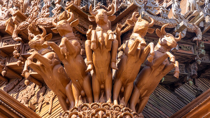 Intricate exterior wooden architecture five bulls on Sanctuary of Truth temple in Pattaya city,...