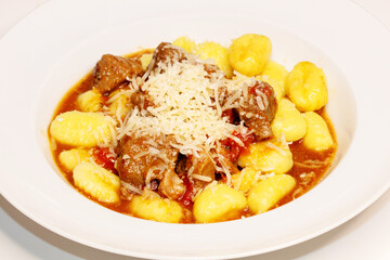 Wild boar ragout with gnocchi and parmesan