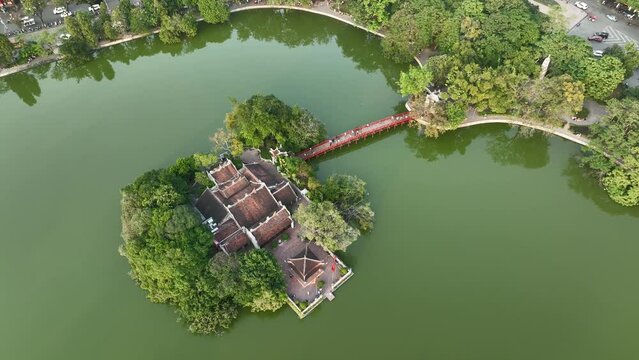 Hoan Kiem lake aerial drone view with Ngoc Son temple and The Huc bridge in Hanoi, Vietnam