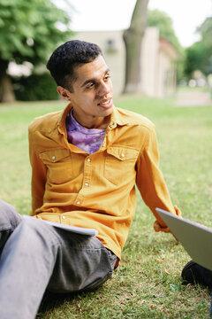 Cheerful multicultural freshman studying chilly dialogue