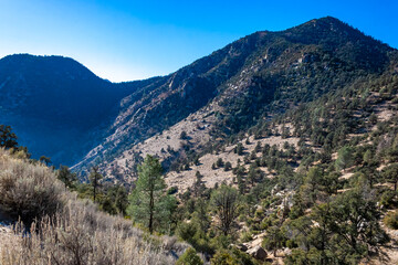 Naklejka na ściany i meble Beautiful mountain scenery on the background of clouds, layers of mountains on the horizon, Sierra Nevada Mountains, California, USA