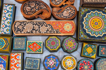 handmade wooden carved Uzbek caskets hand-painted in a souvenir market in Uzbekistan in Tashkent