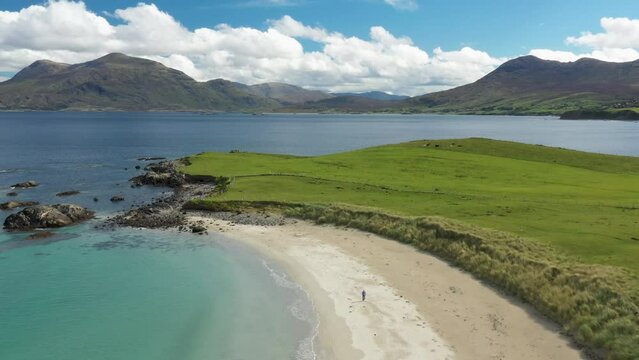 Renvyle Beach, at Tully Cross, north Connemara, Ireland. Looking east to Mweelrea mountains, left, beyond mouth of Killary Harbour. Video fly out