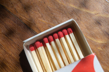 A box of matches with a red head