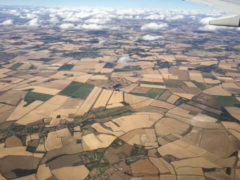 Aerial View of Patchwork Farmland From Airplane